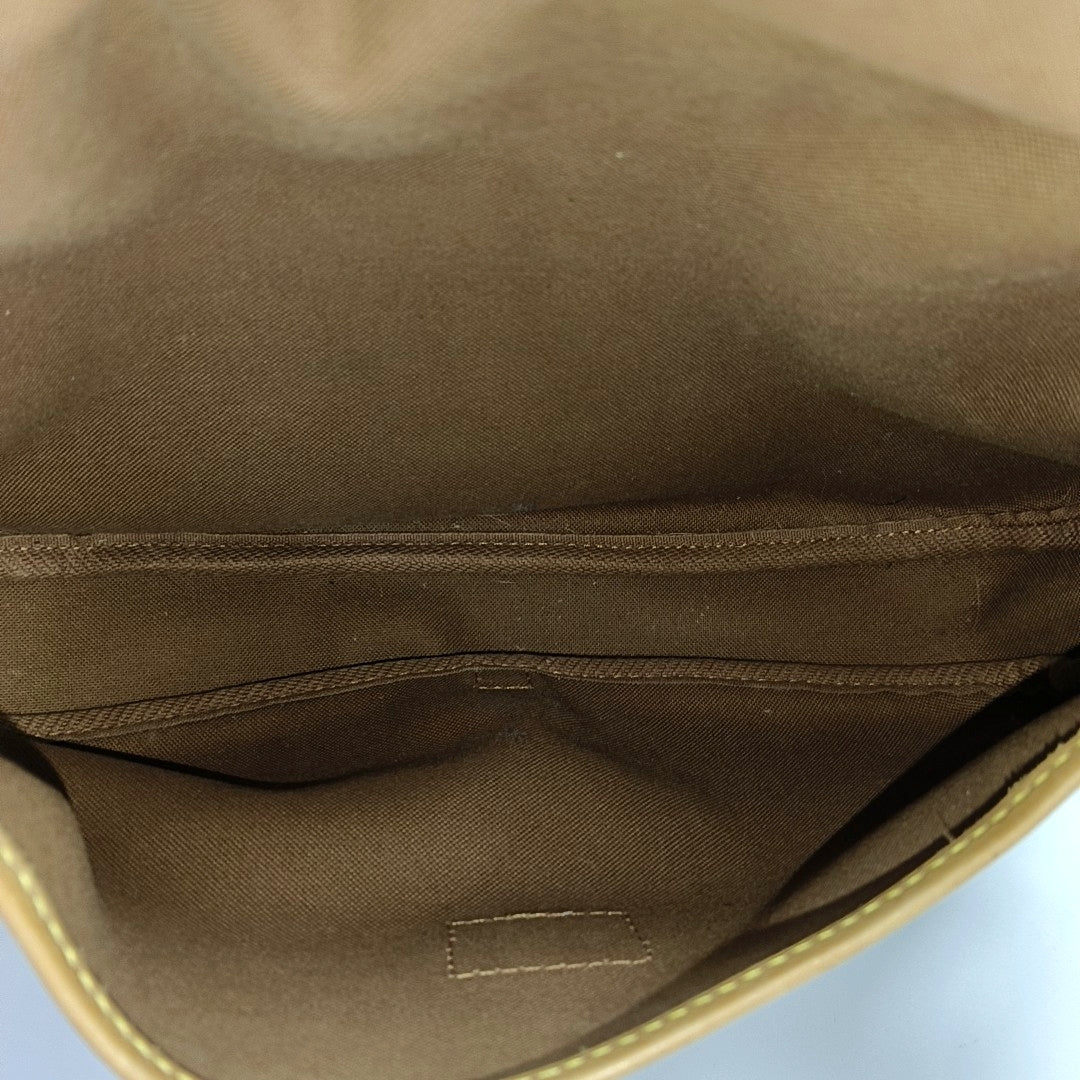 SAUMUR 30 Monogram Coated Canvas Brown