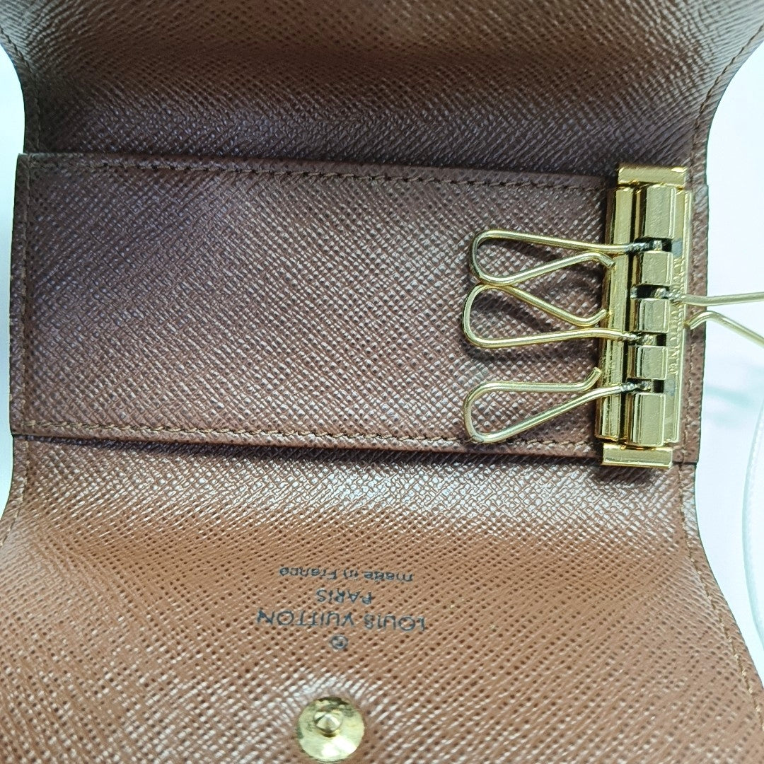Monogram Coated Canvas Clutch Brown