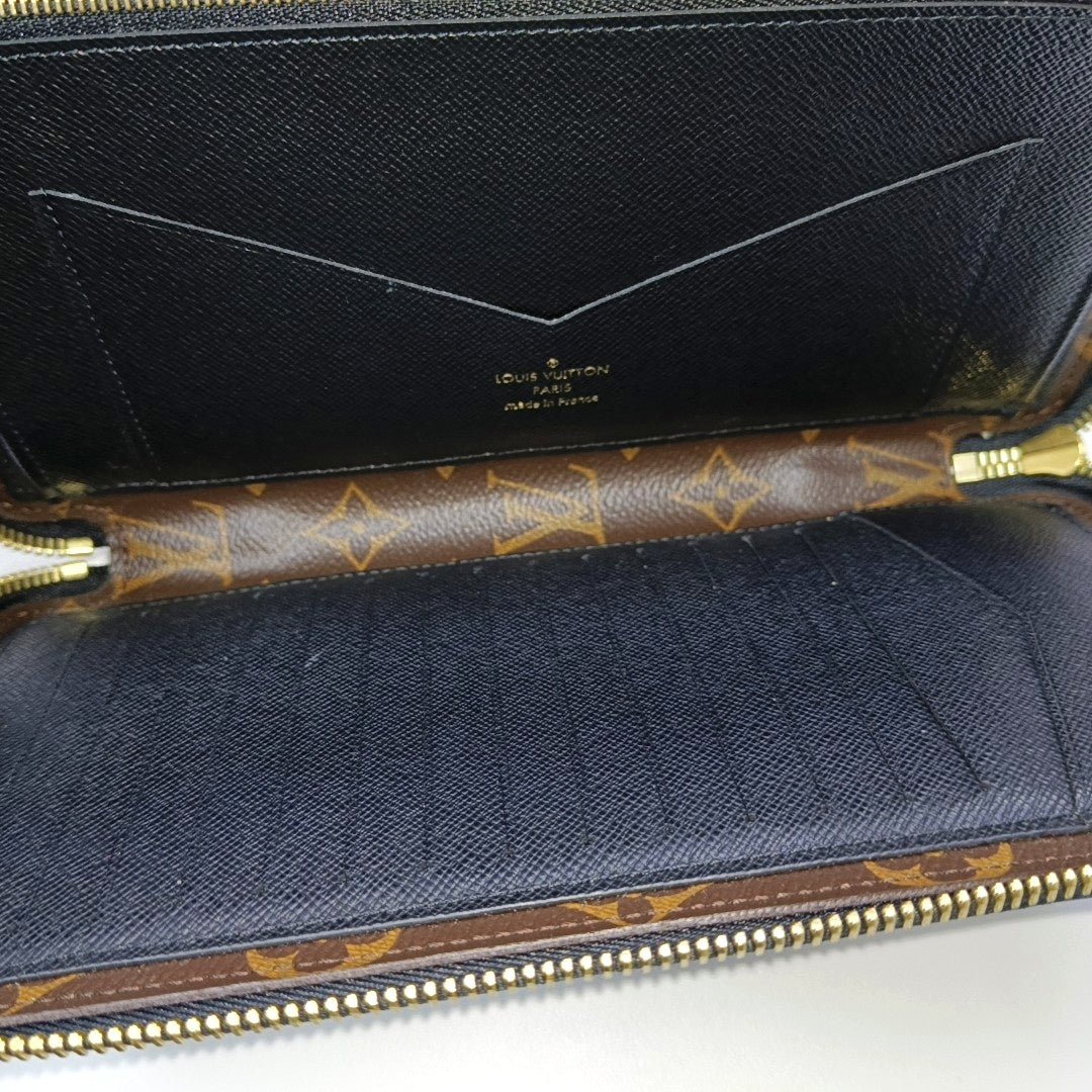 Monogram Coated Canvas Clutch Brown