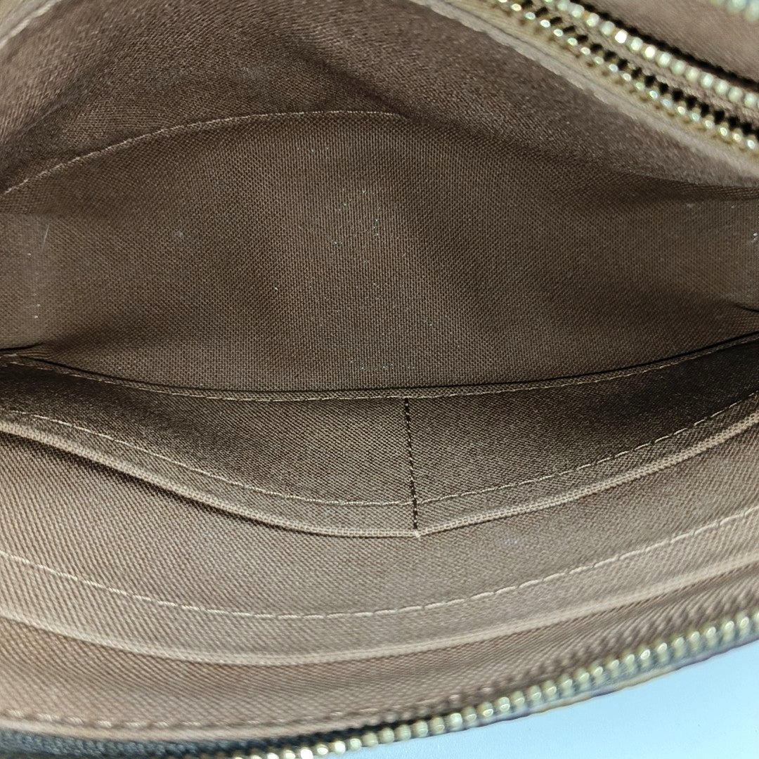 POCHETTE ACCESSOIRES GM Monogram Coated Canvas Brown