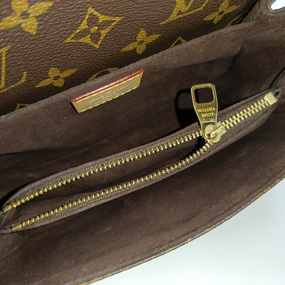 MÉTIS EAST WEST Monogram Coated Canvas Brown
