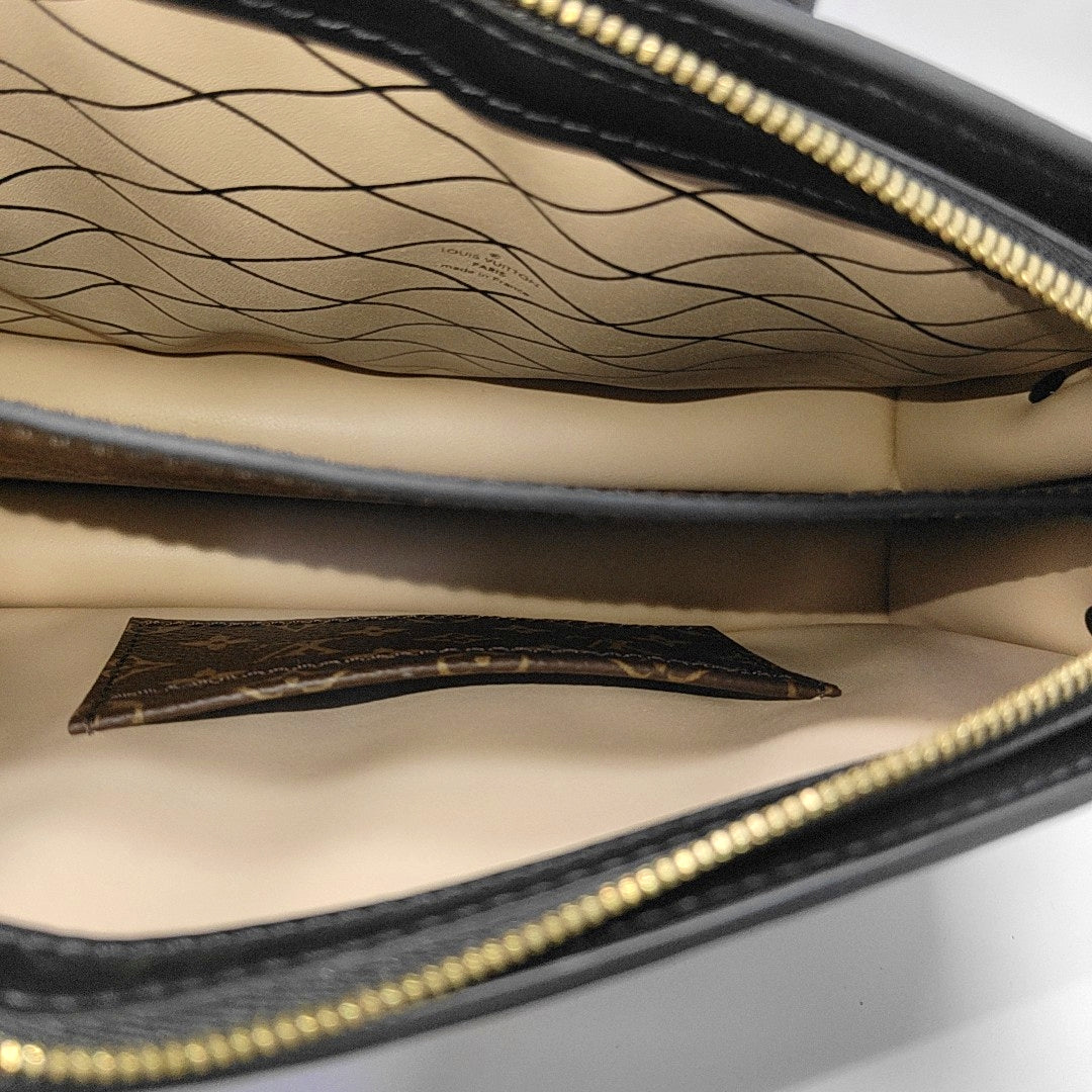 TRUNK Monogram Coated Canvas Brown