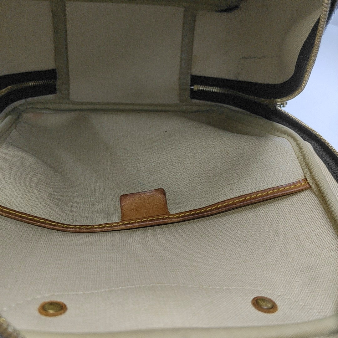 EXCURSION Monogram Coated Canvas Brown