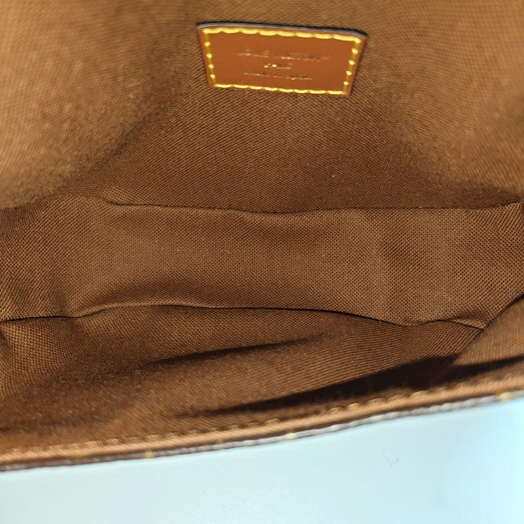 SAUMUR Monogram Coated Canvas Brown