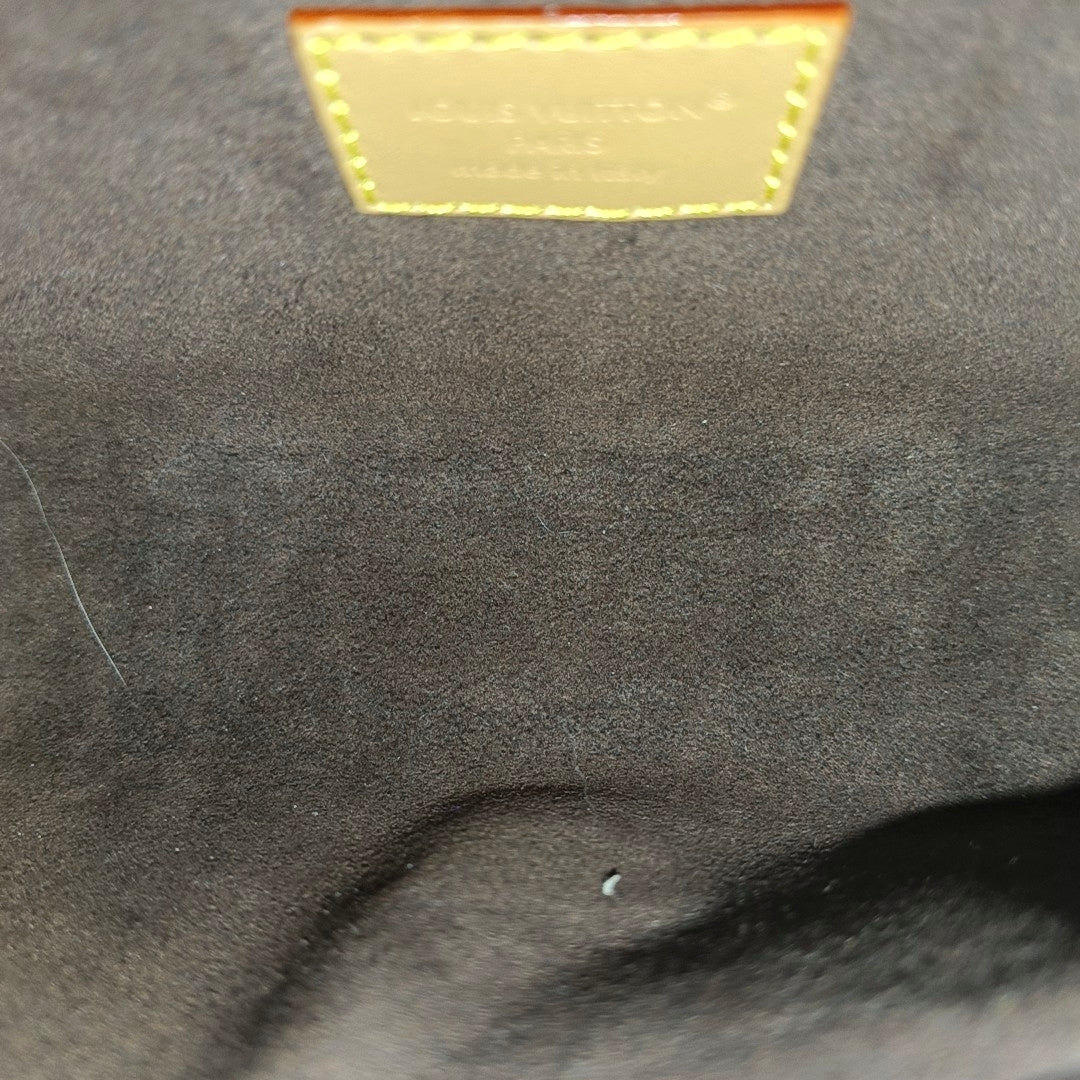 Pochette Camille Monogram Coated Canvas Brown