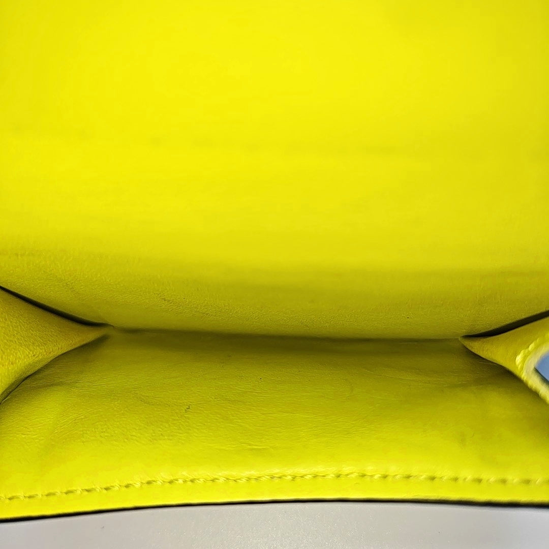 DISCOVERY Monogram Coated Canvas Yellow Card Holder