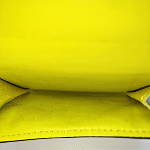 DISCOVERY Monogram Coated Canvas Yellow Card Holder