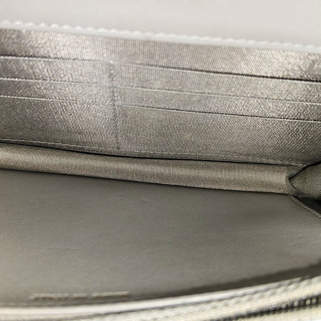 Authenticated pre-owned  BOY CHANEL WOC Quilted Grained Calfskin Grey - Shoulder Bag at Looply