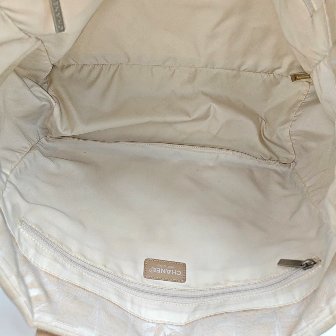 Authenticated pre-owned  TRAVEL LINE Canvas Beige - Top Handle Bag at Looply