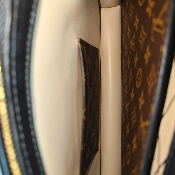 TRUNK Monogram Coated Canvas Brown