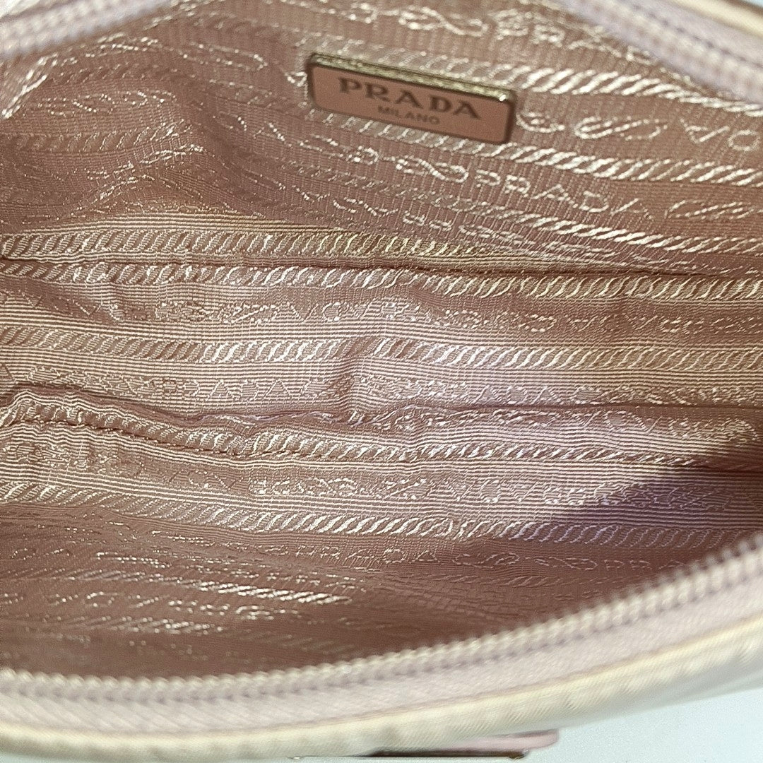 Authenticated pre-owned  Re-Edition Nylon Pink - Top Handle Bag at Looply