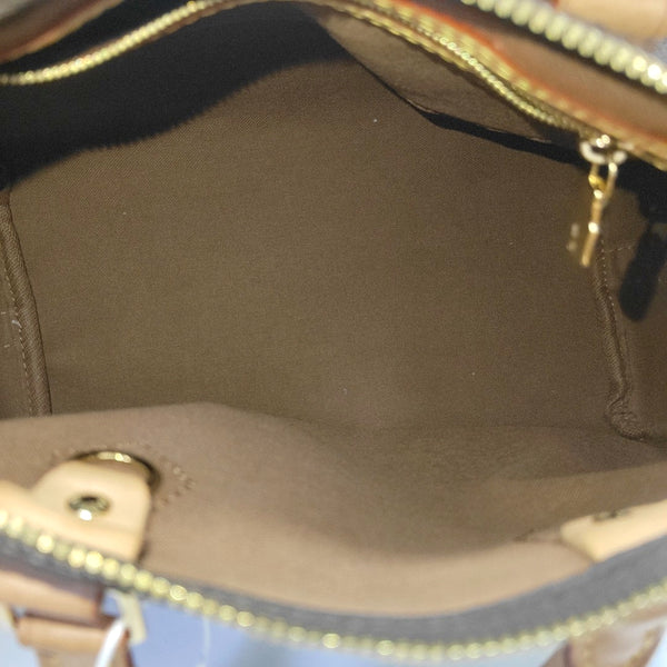 SPEEDY 25 Monogram Coated Canvas Brown
