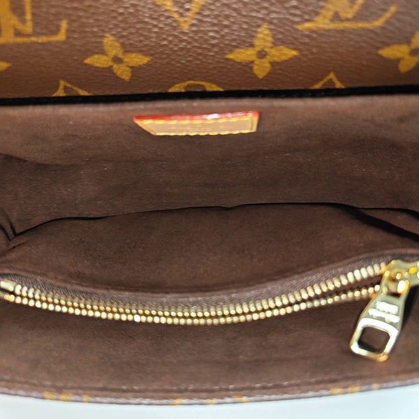 MÉTIS EAST WEST Monogram Coated Canvas Brown