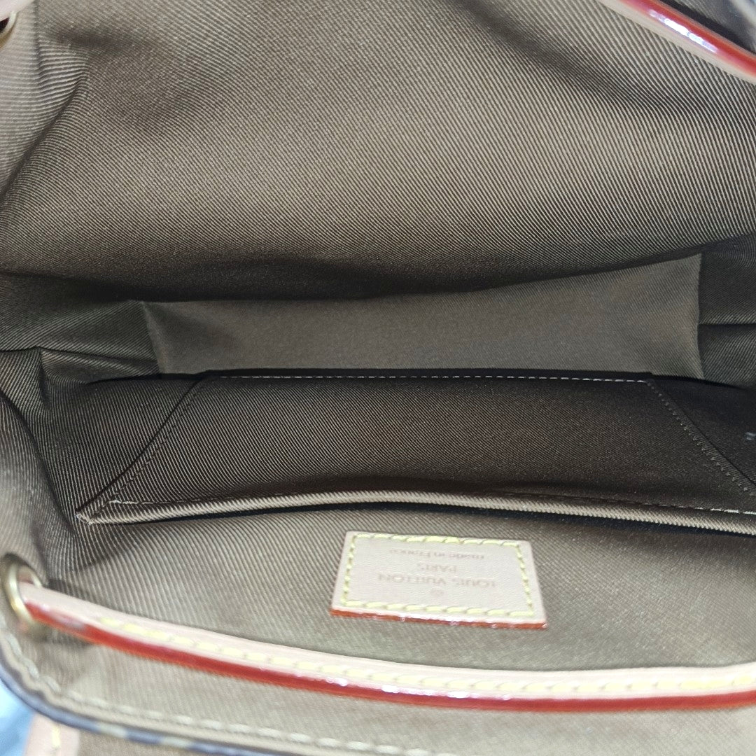 EXCURSION PM Monogram Coated Canvas Brown