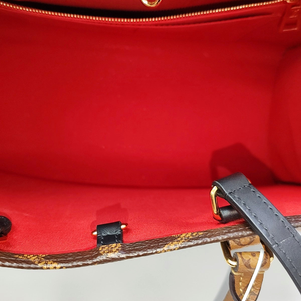 ONTHEGO MM Monogram Coated Canvas Brown