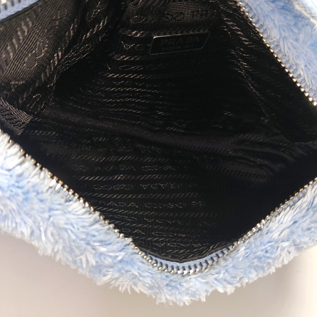 Authenticated pre-owned  Re-Edition2000 Mini Terry Cloth Blue - Top Handle Bag at Looply