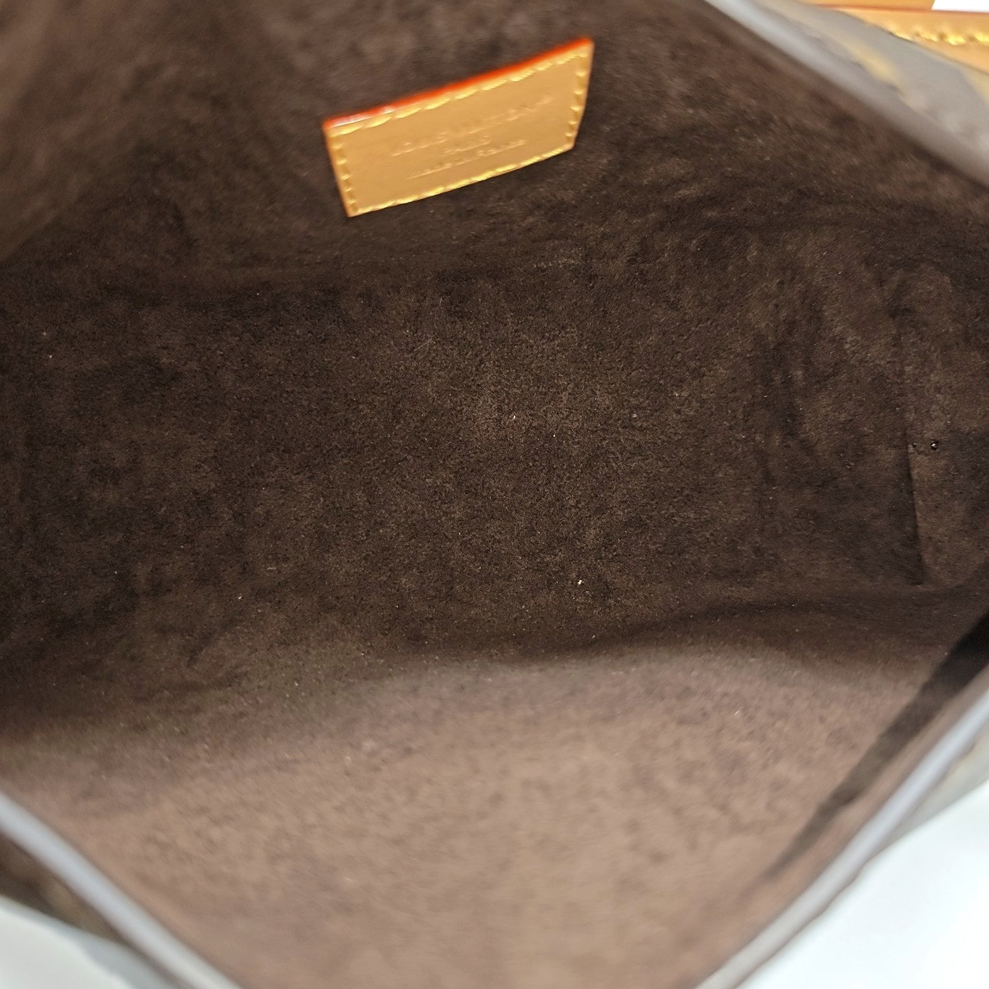 Pochette Mia Monogram Coated Canvas Brown
