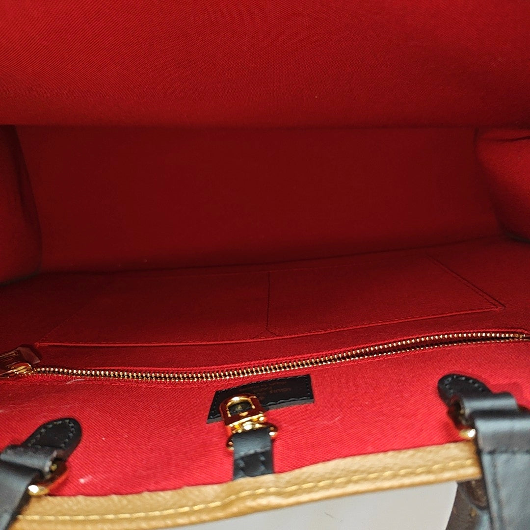 ONTHEGO GM Monogram Coated Canvas Brown