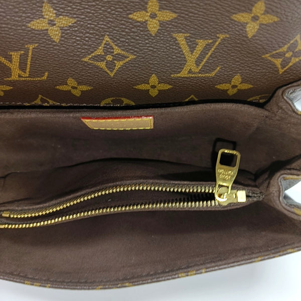 MÉTIS EAST WEST Monogram Coated Canvas Brown