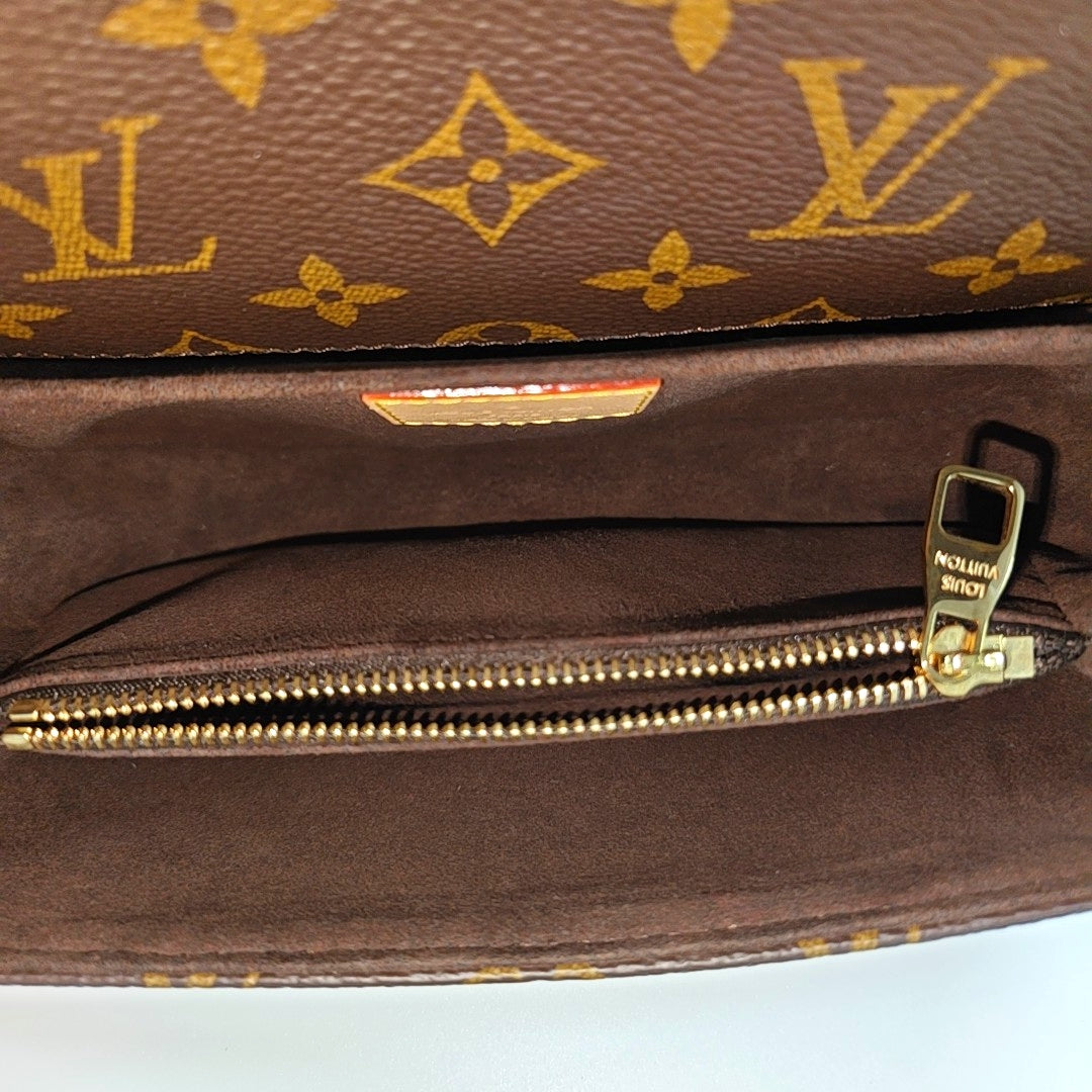 MÉTIS EAST WEST Monogram Coated Canvas Brown