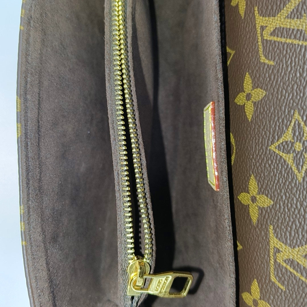 MÉTIS EAST WEST Monogram Coated Canvas Brown