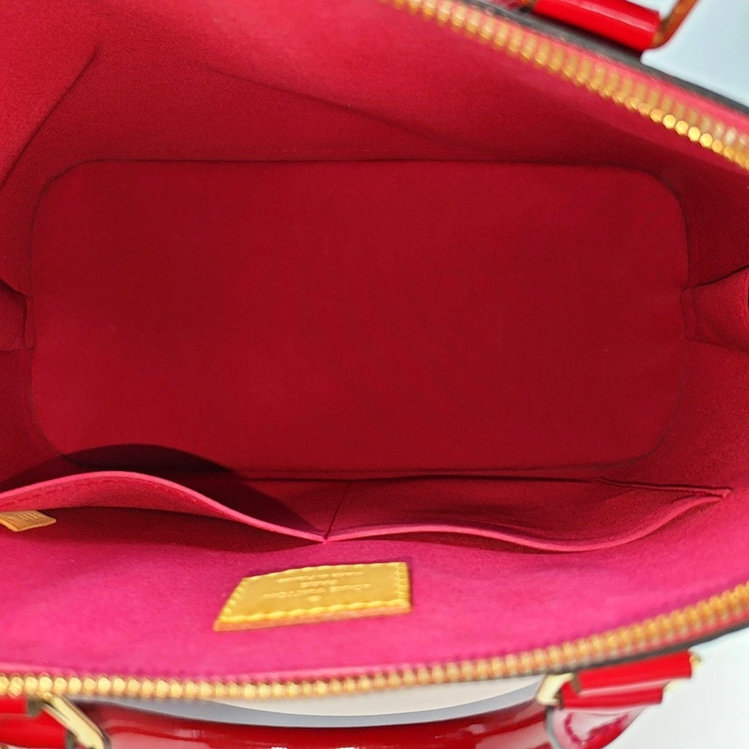 Authenticated pre-owned  ALMA PM Monogram Patent Leather Red - Top Handle Bag at Looply