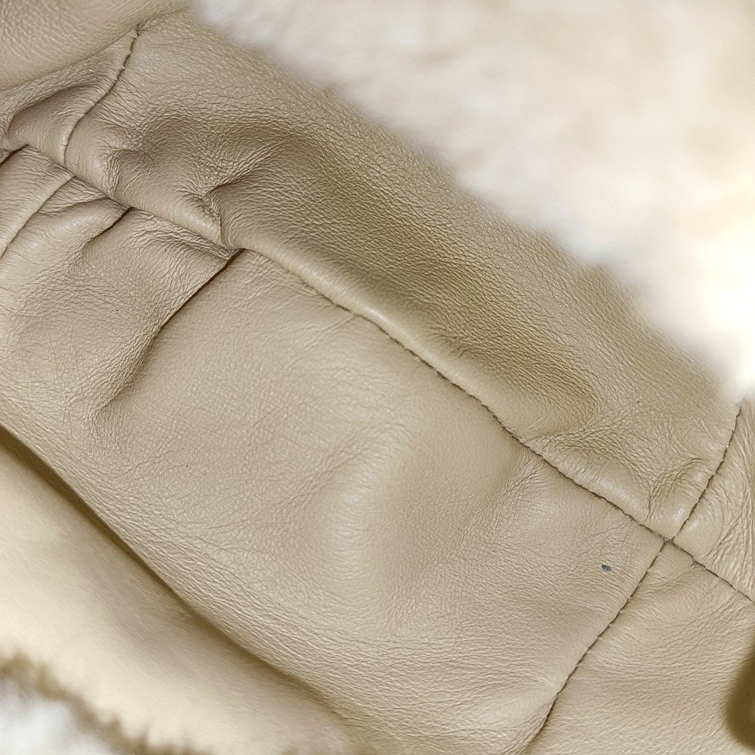 Authenticated pre-owned  Jodie Mini Sheepskin Yellow - Top Handle Bag at Looply