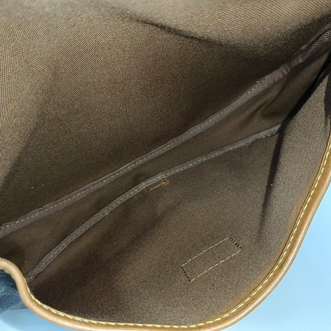 SAUMUR Monogram Coated Canvas Brown