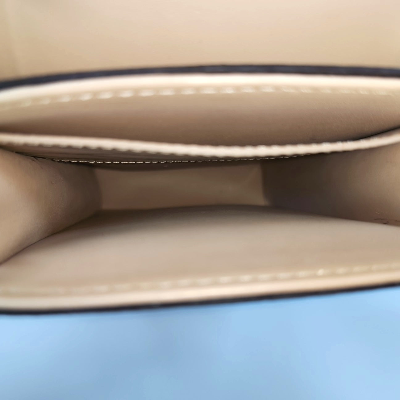 TRUNK Monogram Coated Canvas Brown
