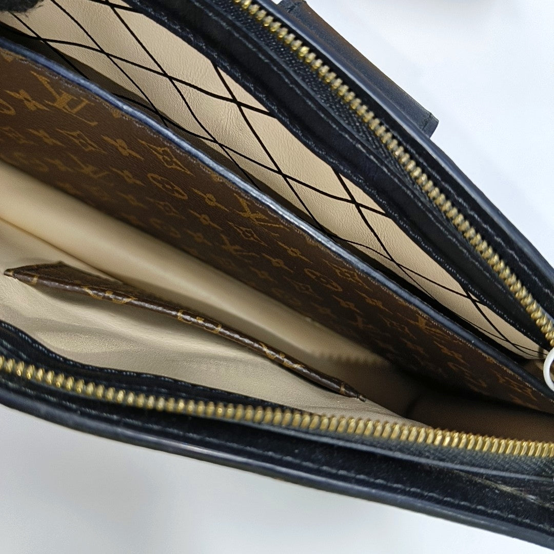 TRUNK Monogram Coated Canvas Brown