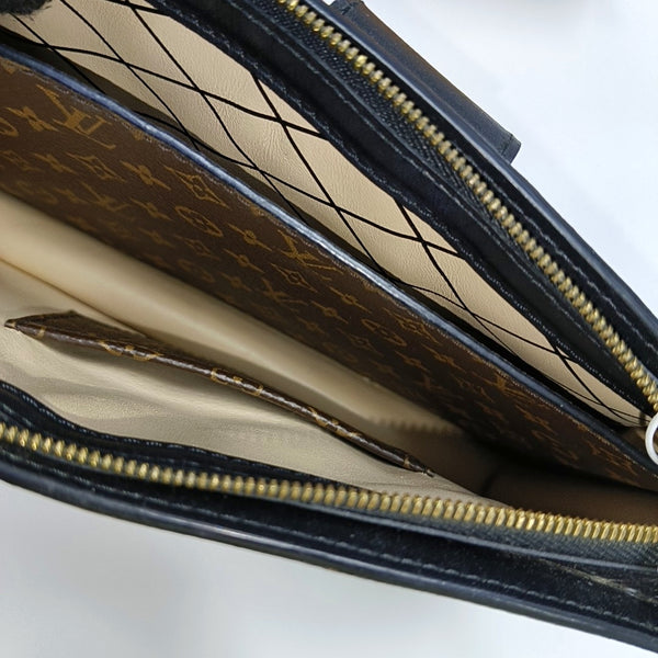 TRUNK Monogram Coated Canvas Brown