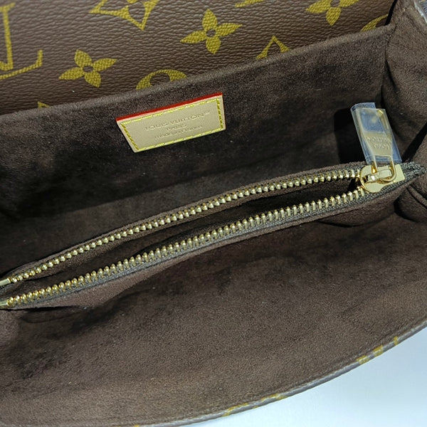 MÉTIS EAST WEST Monogram Coated Canvas Brown
