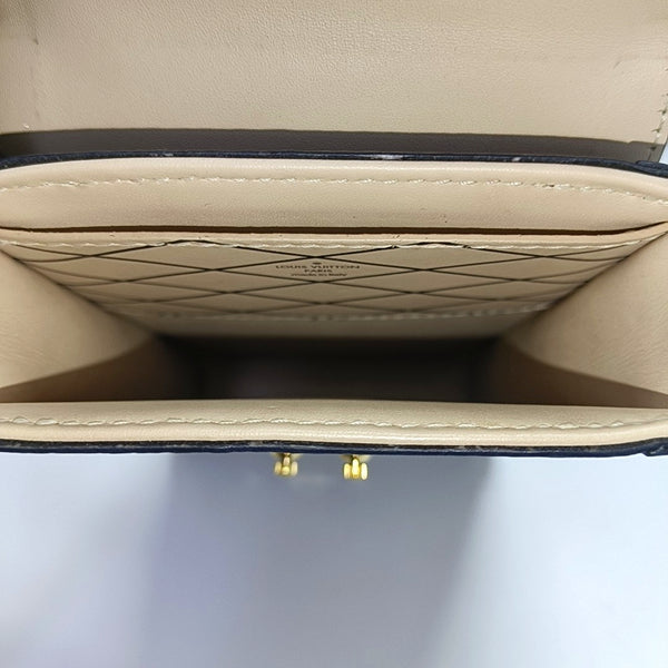 TRUNK Monogram Coated Canvas Brown