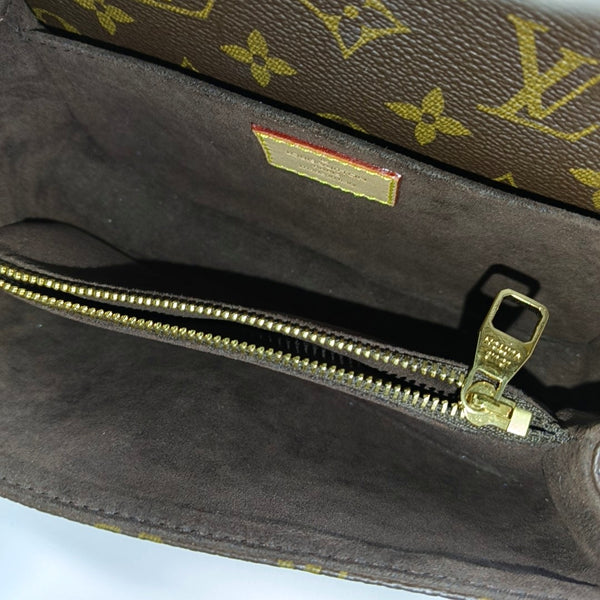 MÉTIS EAST WEST Monogram Coated Canvas Brown