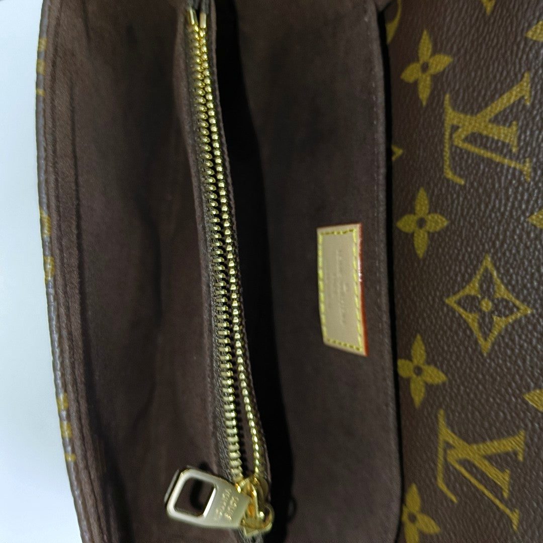 MÉTIS EAST WEST Monogram Coated Canvas Brown