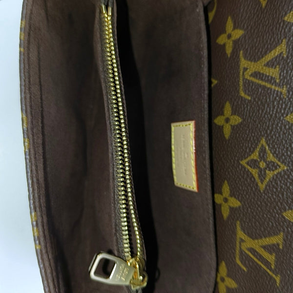 MÉTIS EAST WEST Monogram Coated Canvas Brown