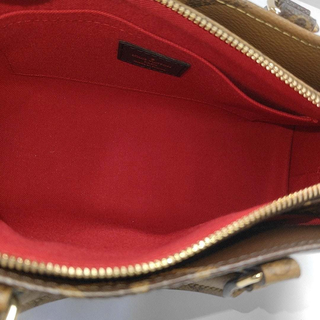 ONTHEGO EAST WEST PM Monogram Coated Canvas Brown
