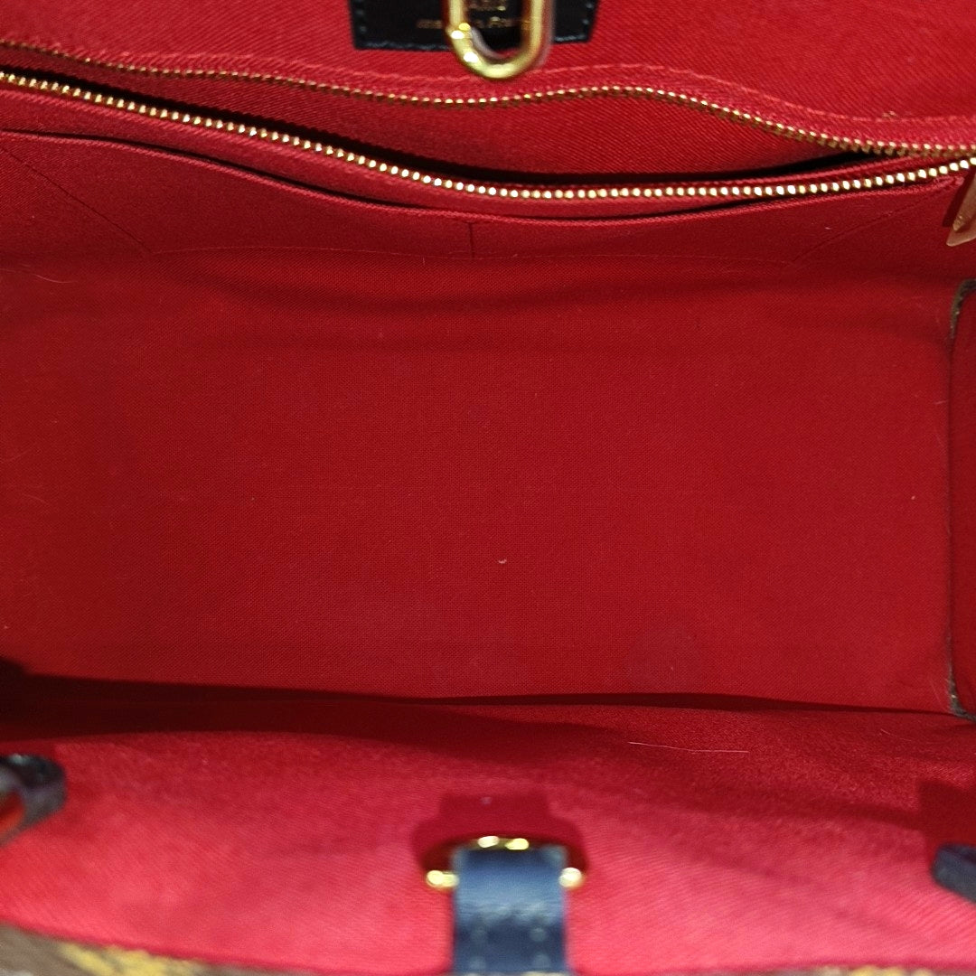 ONTHEGO MM Monogram Coated Canvas Brown