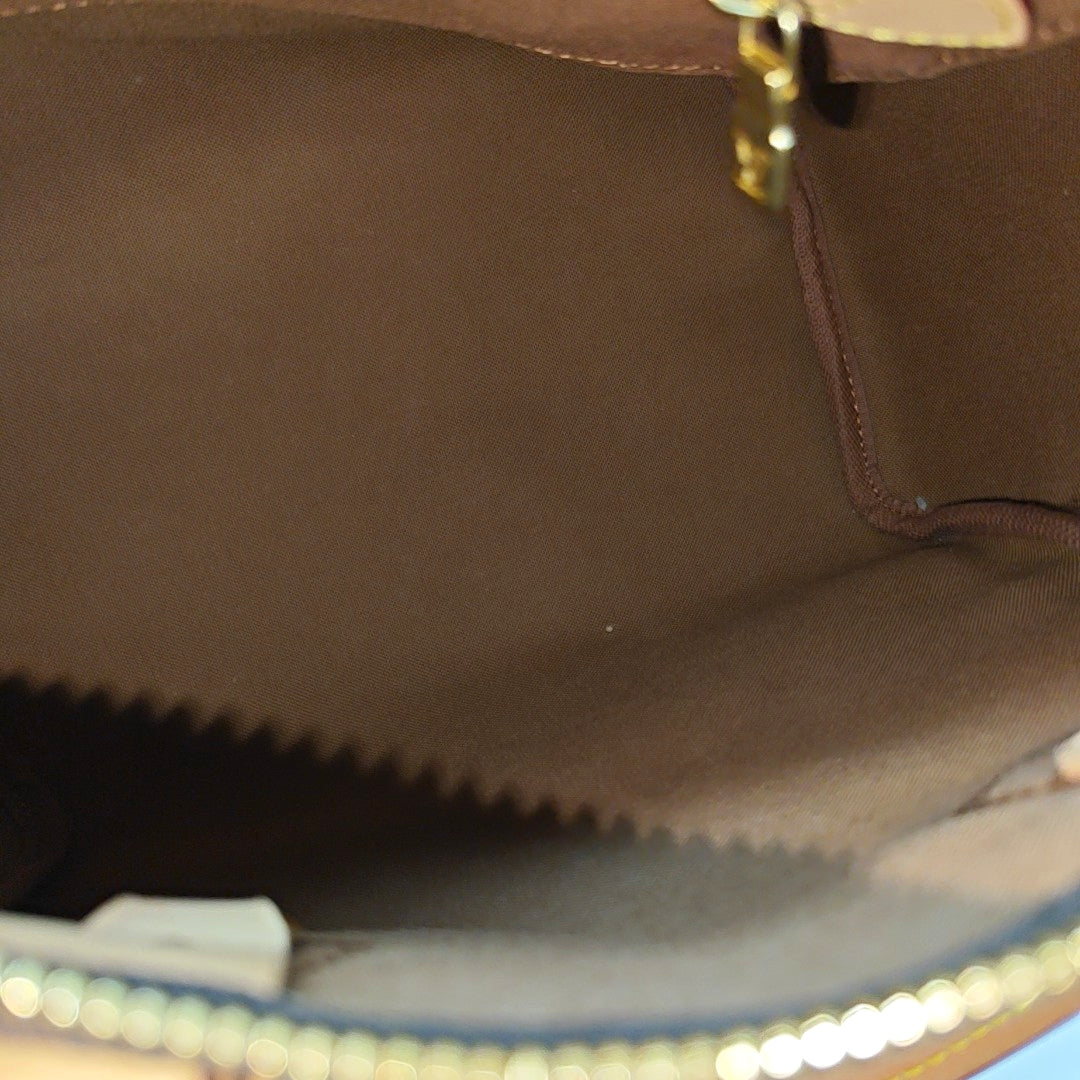 SPEEDY 25 Monogram Coated Canvas Brown
