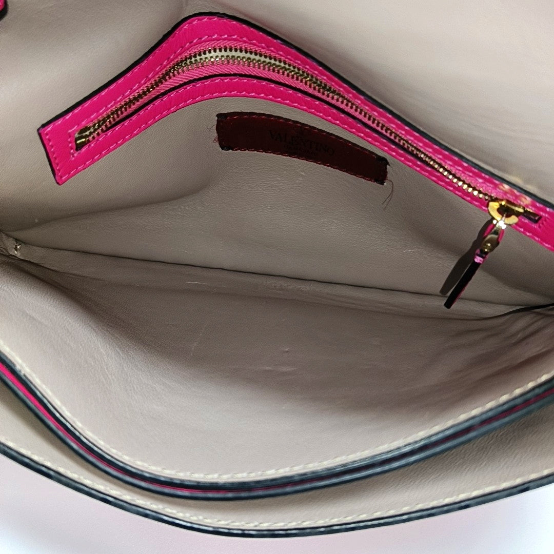 Authenticated pre-owned  Rockstud Lambskin Pink - Clutch at Looply