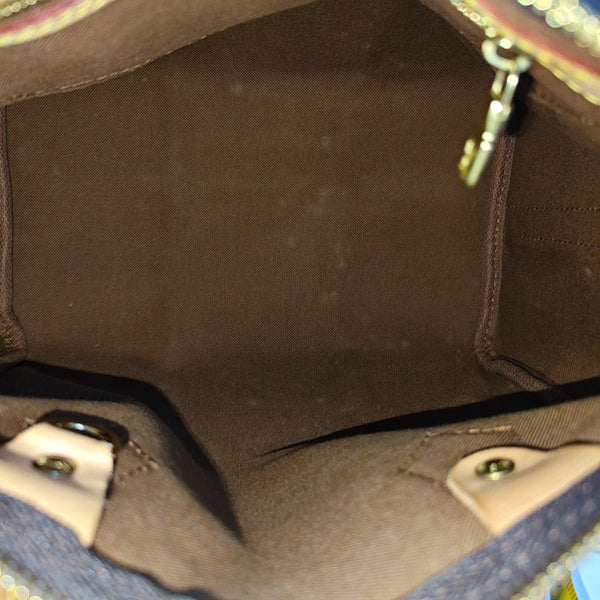 SPEEDY 25 Monogram Coated Canvas Brown