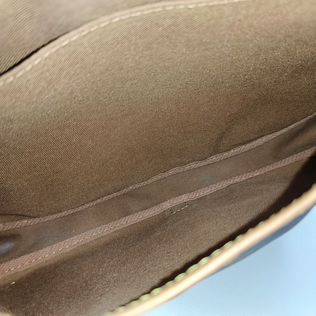 SAUMUR Monogram Coated Canvas Brown