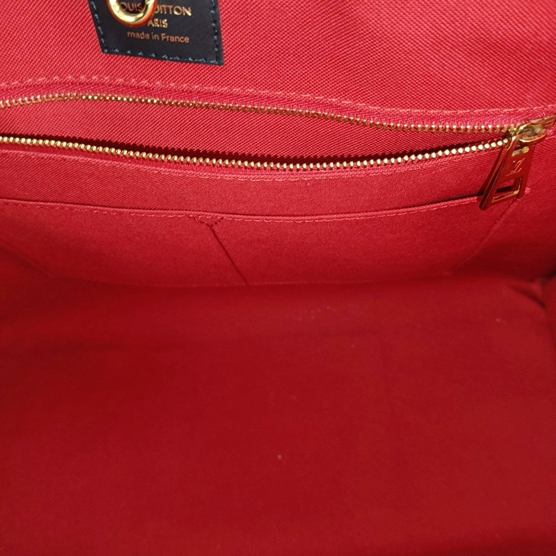 ONTHEGO GM Monogram Coated Canvas Brown