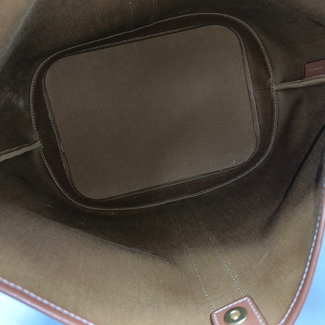 Authenticated pre-owned  TRIOMPHE CANVAS Medium Coated Canvas Yellow - Bucket Bag at Looply