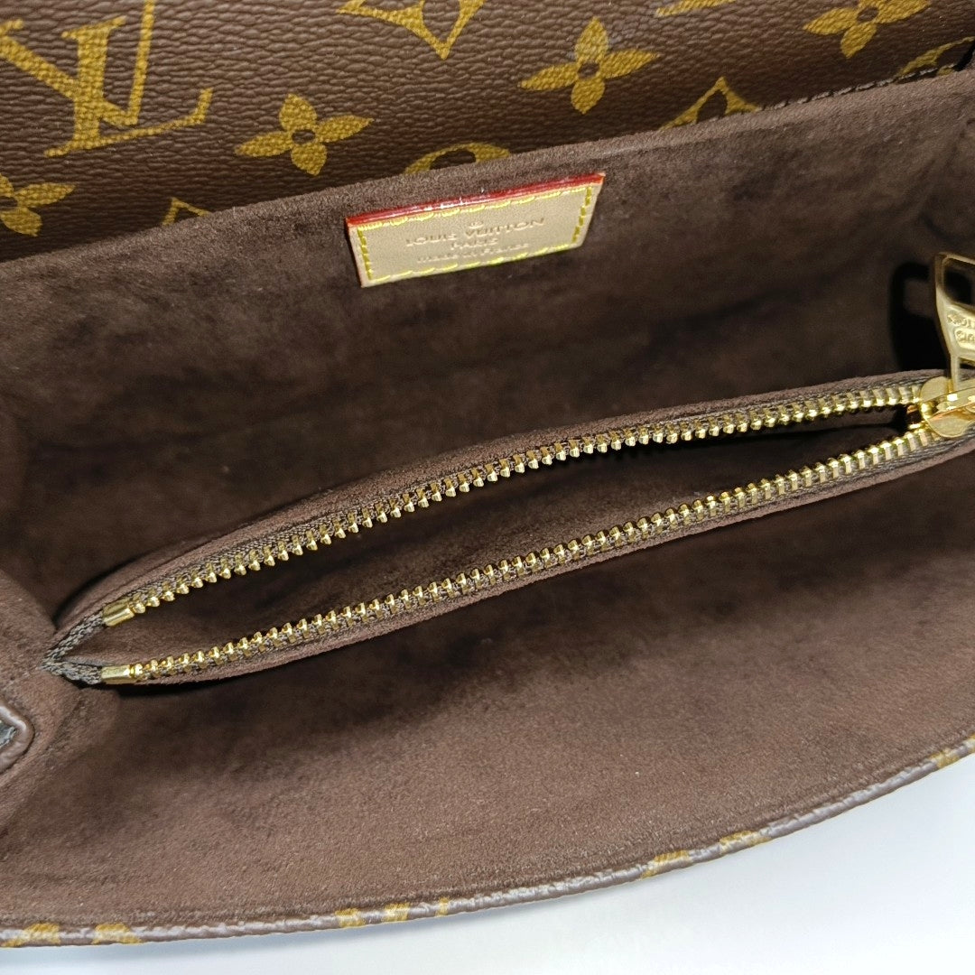 MÉTIS EAST WEST Monogram Coated Canvas Brown