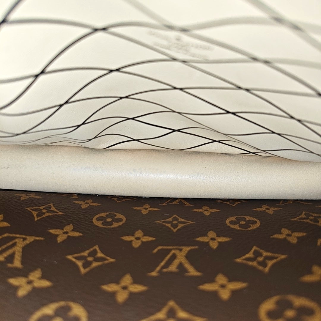 TRUNK Monogram Coated Canvas Brown