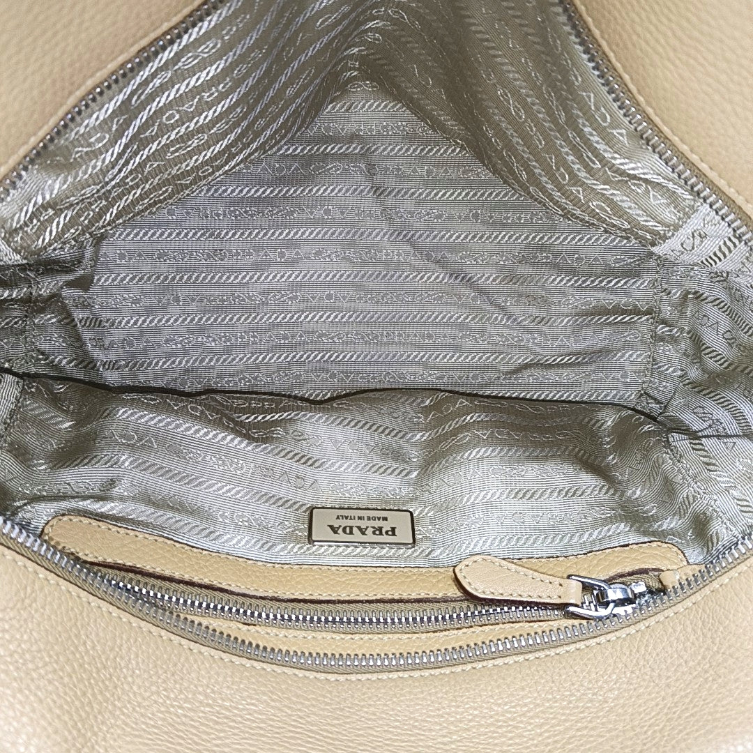 Authenticated pre-owned  Bauletto Saffiano Calfskin Beige - Top Handle Bag at Looply
