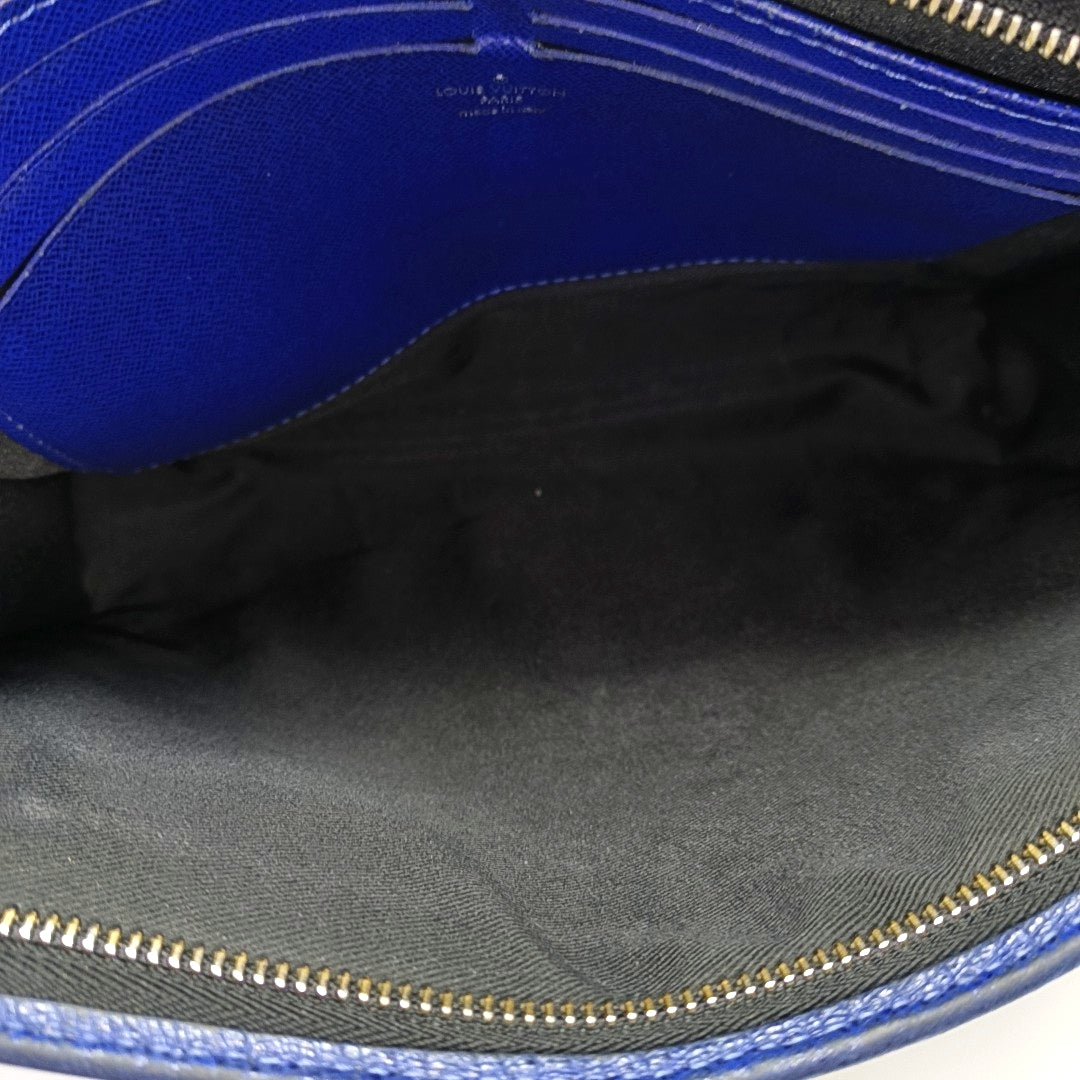 Pochette Voyag MM Monogram Coated Canvas Blue