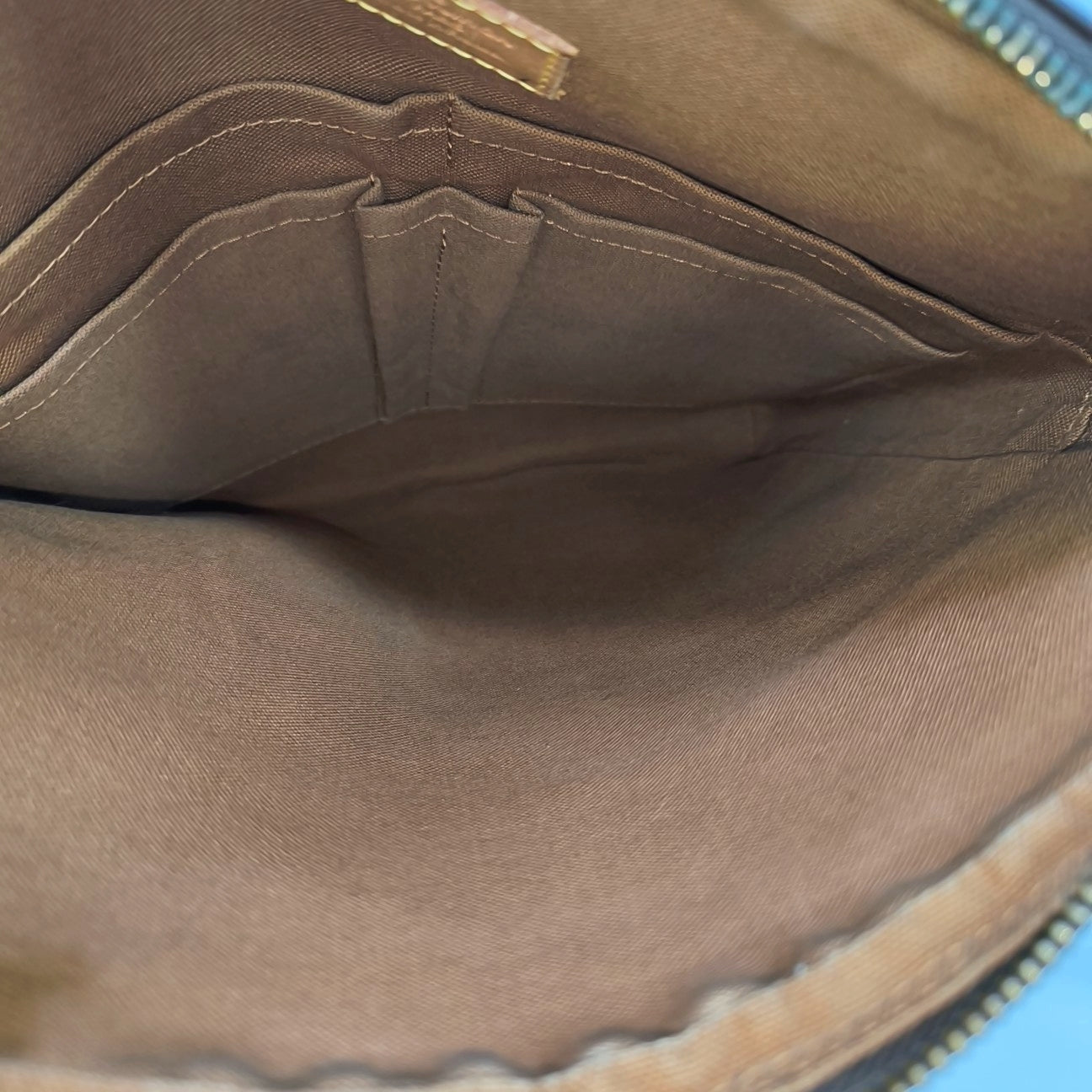 TROTTEUR Monogram Coated Canvas Brown