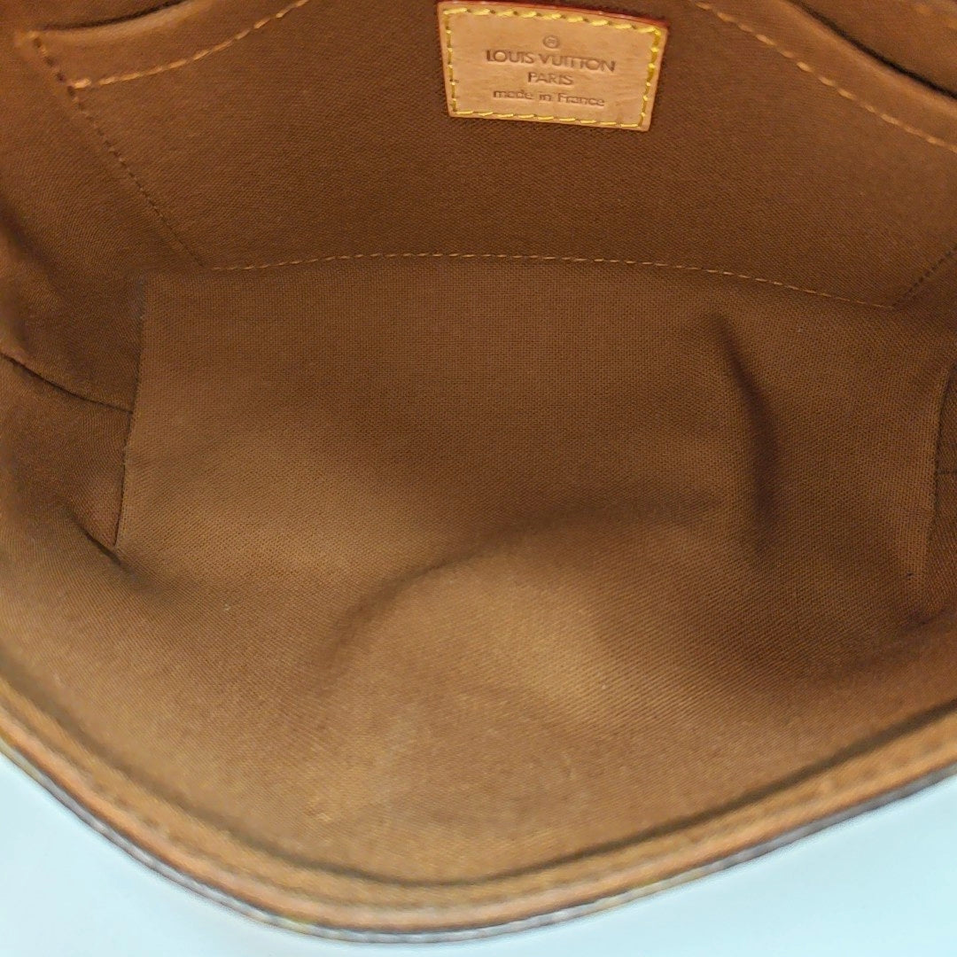 TIKAL Monogram Coated Canvas Brown